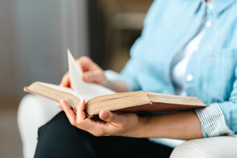 Close up Woman hand open book and reading for education